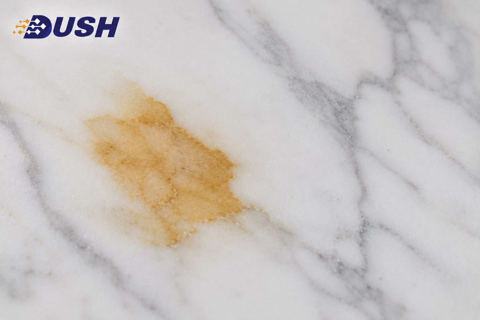 Yellowing on white marble surface compared to surrounding clean stone