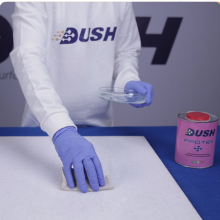 Dush Protek+ Step 2 — spread sealer evenly on white marble with cotton cloth