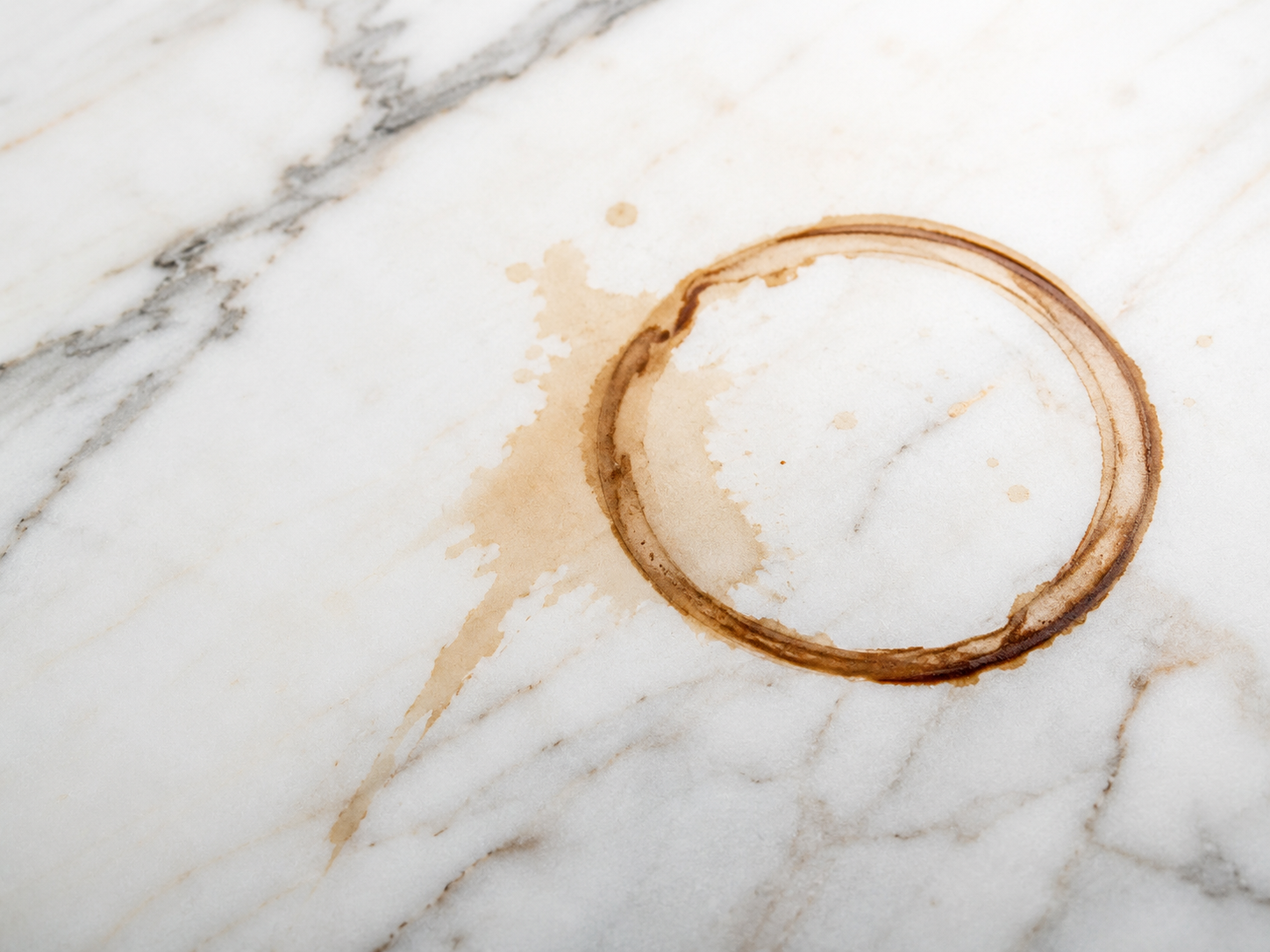 Red wine and food staining on a white marble surface